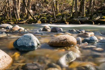Fototapeta na wymiar long exposure of the rocky creek in the morning