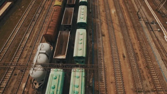 Railway yard with a lot of railway lines and freight trains. Aerial