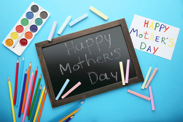 Inscriptions Happy Mothers Day drawn by watercolor paints and chalks