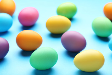 Colorful easter eggs on mint background