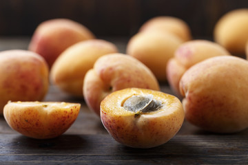 Apricot fruit. Fresh organic apricots on  wooden background.
