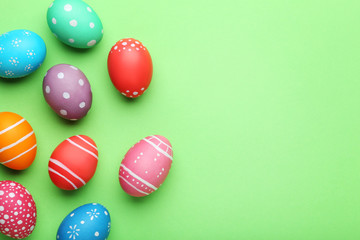 Colorful easter eggs on green background