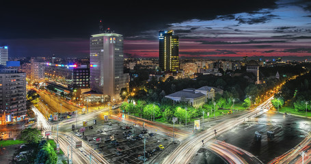 Aerial view of the business district in the Victoria Square. Night lights after a storm, sunset in Bucharest, Romania.