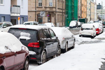 snowbound german cars parked at the roadside