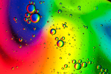 abstract multicolored background made of oil bubbles on water