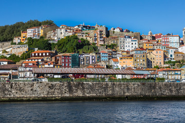 Fototapeta na wymiar Colorful Facades of Typical Houses on the Bank of the River Douro - Porto, Portugal
