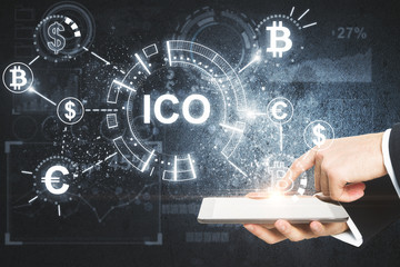 Hand using tablet with ico hologram