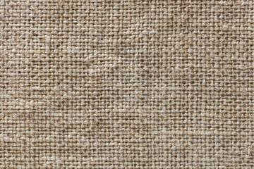 Fototapeta na wymiar Rough texture of burlap, textile background closeup
