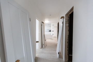 Interior in a new apartment without repair with white door