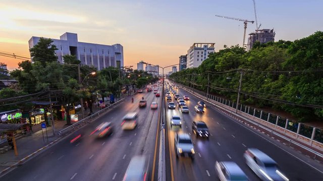 4k Day to Night Time-lapse of traffic on Ngamwongwan Road at Kasetsart University in bangkok, Thailand