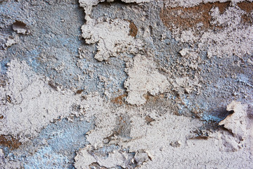 Separated plaster or blue with a brown wall