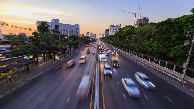 4k Day to Night Time-lapse of traffic on Ngamwongwan Road at Kasetsart University in bangkok, Thailand