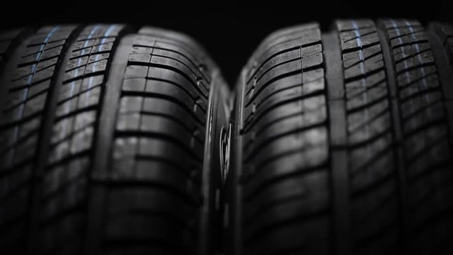 New and unused car tires spinning