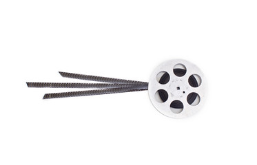 Obraz premium old 8mm cine film and reel on white