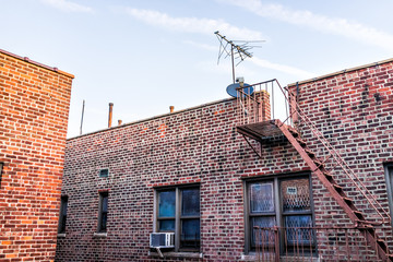 Brick apartment condo building roof exterior architecture in Fordham Heights center, Bronx, NYC,...