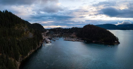 Obraz premium Aerial panoramic view of Horseshoe Bay in Howe Sound during a vibrant cloudy sunset. Taken West Vancouver, British Columbia, Canada.