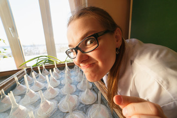 Crazy male scientist or student is in his laboratory