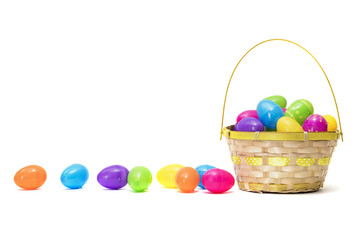 Easter eggs in basket isolated on white background