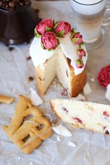 Easter cake with roses and coffee on the table  