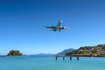 Obraz na płótnie Canvas Aircraft approaching Corfu International Airport. Corfu island, Greece.