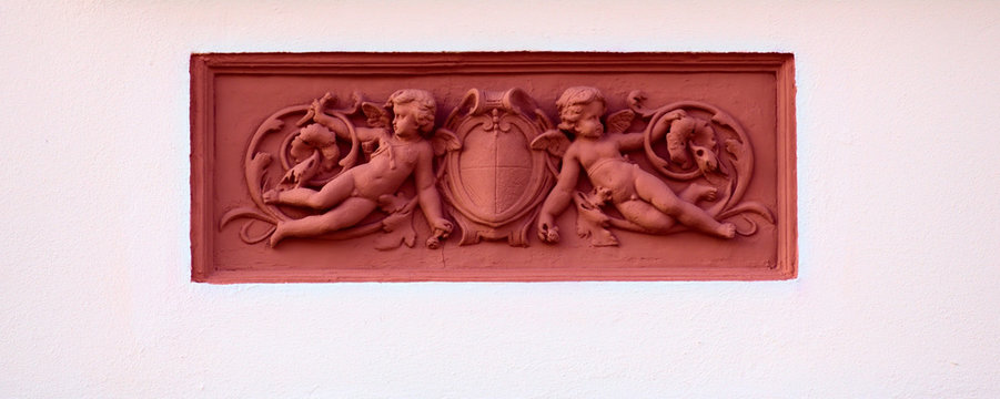 Ornaments with putti on a historic house from 1888 in Greifswald, Germany