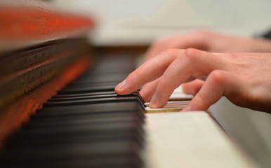 Fototapeta na wymiar piano playing fingers