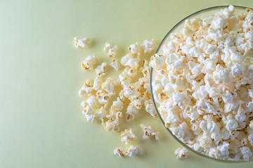 Popcorn on a bright yellow background top view