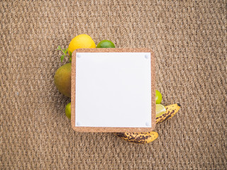 Close-up top view of tropical fruits and sign with space for a text