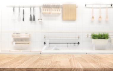 Wood table top on blur kitchen room background - obrazy, fototapety, plakaty