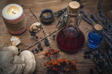 Obraz na płótnie Canvas Magic potion. Alternative herbal medicine. Shaman table with copy space. Druidism concept. Witch doctor desk background.
