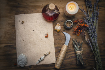 Magic potion ancient recipe scroll with copy space. Alternative herbal medicine. Shaman table with...