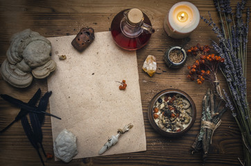 Magic potion ancient recipe scroll with copy space. Alternative herbal medicine. Shaman table with...