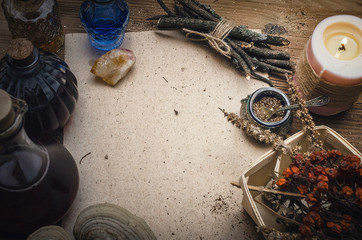 Magic potion ancient recipe scroll with copy space. Alternative herbal medicine. Shaman table with...