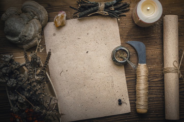 Magic potion ancient recipe scroll with copy space. Alternative herbal medicine. Shaman table with...