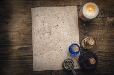Magic potion ancient recipe scroll with copy space. Alternative herbal medicine. Shaman table with...