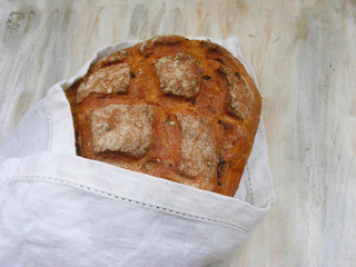 brown bread on a white napkin flat view
