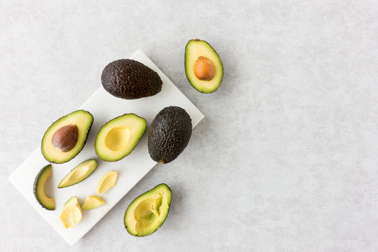 Avocados On A Marble Chopping Board