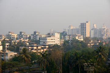 Landscape aerial view of Navi Mumbai in seawoods at evening in sunset. smoke and smog