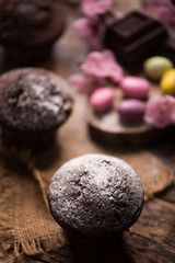 Fototapeta na wymiar Chocolate muffin. Homemade bakery on wooden background