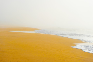 Picturesque scenery seascape of foggy misty abandoned wild beach. Art beautiful landscape of deserted cost with ocean waves. Colorful nature paysage. Desolate mediterranean costline. Fairy tale view.