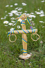 Maypole decoration in the grass amoung the daisy flowers