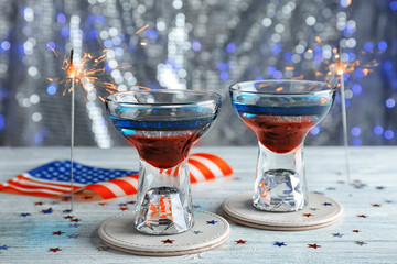 Layered cocktails in colors of American flag on table