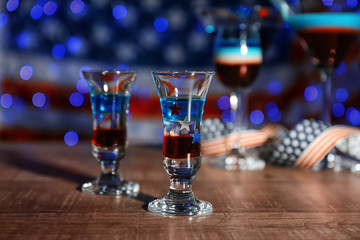 Layered cocktails in colors of American flag on table