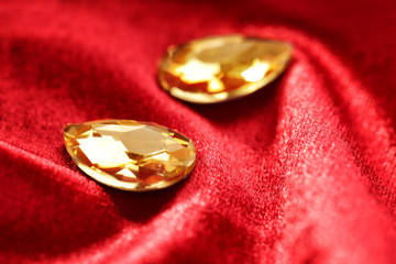 Precious stones for jewellery on red velvet