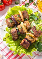 Grilled shish kebab or shashlik on white.