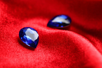 Precious stones for jewellery on red velvet