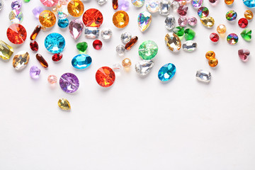 Colorful precious stones for jewellery on white background