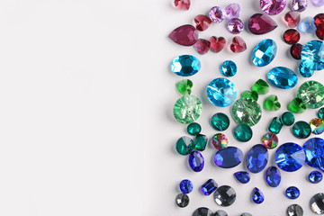 Colorful precious stones for jewellery on white background