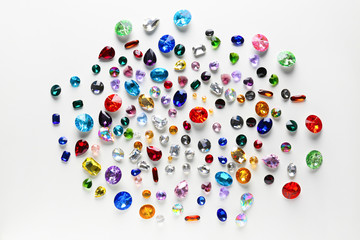 Colorful precious stones for jewellery on white background