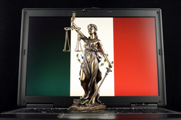 Symbol of law and justice with Mexico Flag on laptop. Studio shot.